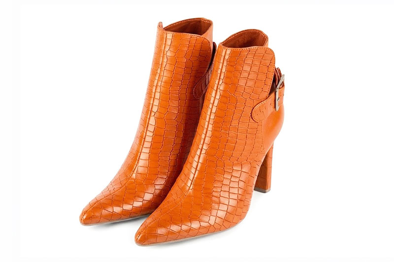 Dress ankle boots back buckles in apricot orange leather with high slim heels and tapered toe - Front view